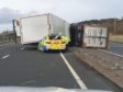 The police car was partially crushed by the lorry