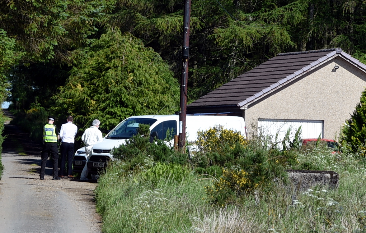 Police in Cuminestown following the death