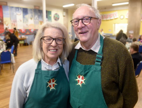 Companions of the Order of Malta Godfrey and Claire Macdonald help out with  the homeless and needy attending Inverness Foodstuff for a free warm meal at Ness Bank Church Hall in Inverness. Pictures by Sandy McCook