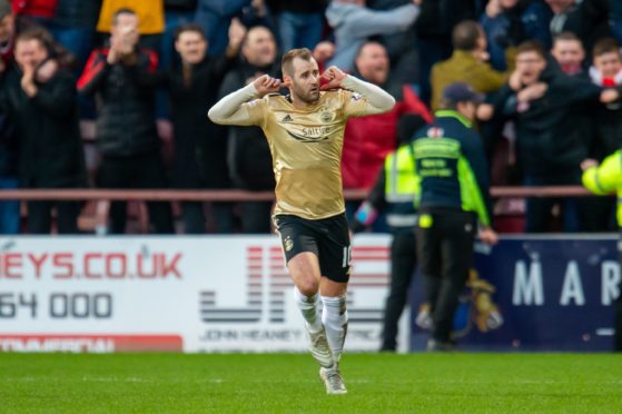 Editorial use only
Mandatory Credit: Photo by Malcolm Mackenzie/ProSports/REX/Shutterstock (10514364bb)
Niall McGinn (#10) of Aberdeen FC runs away with his fingers in his ears after scoring the equalising goal during the Ladbrokes Scottish Premiership match between Heart of Midlothian FC and Aberdeen FC at Tynecastle Stadium, Edinburgh
Heart of Midlothian v Aberdeen, Ladbrokes Scottish Premiership - 29 Dec 2019