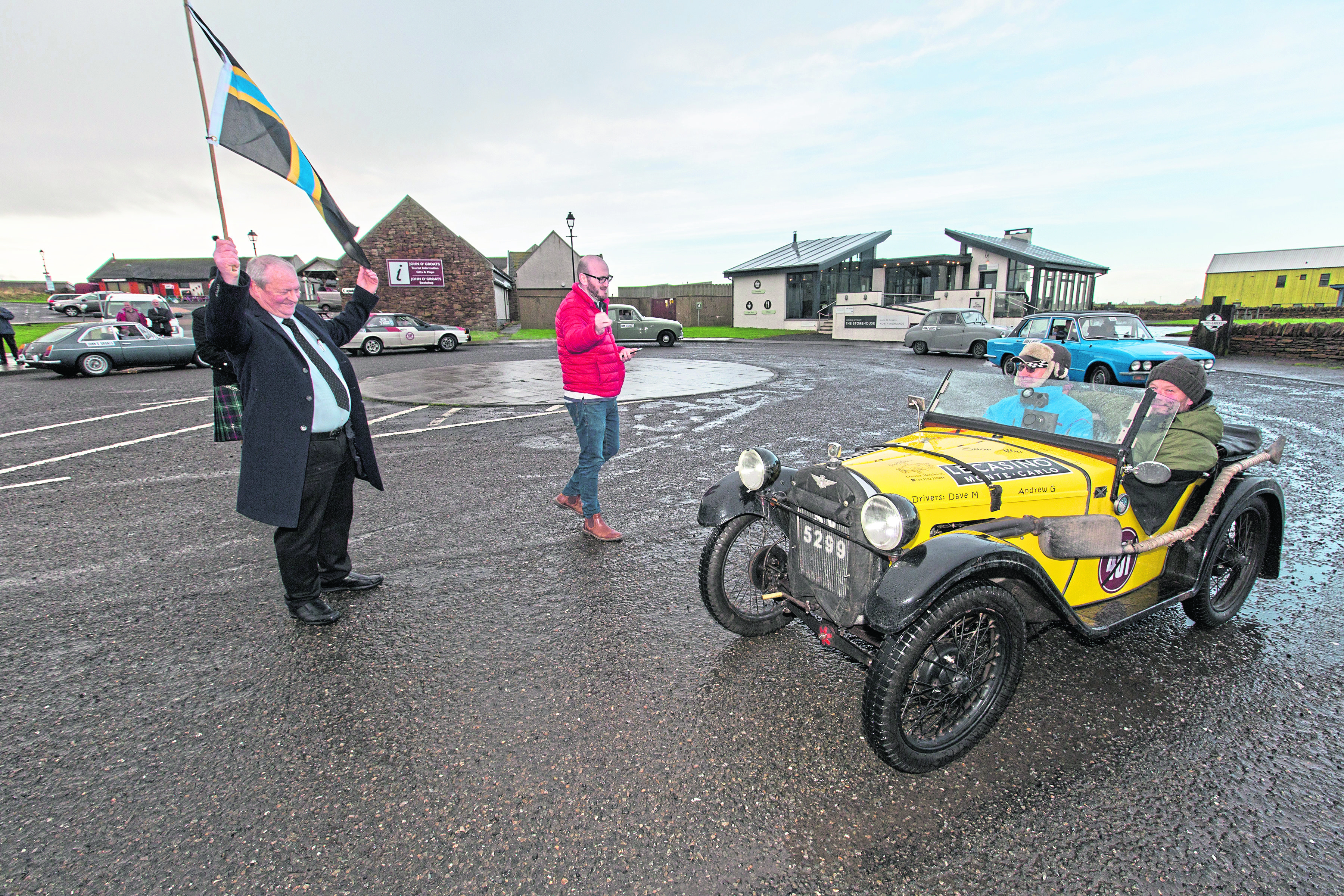 Andrew Goodlellow and Dave Muir from Dundee, in their 1930 Austin 7 Elite are flagged off from John O'Groats at the start of the Monte Carlo heritage rally, by local businessman Walter Mowat, on Tuesday morning. Photo: Robert MacDonald/Northern Studios