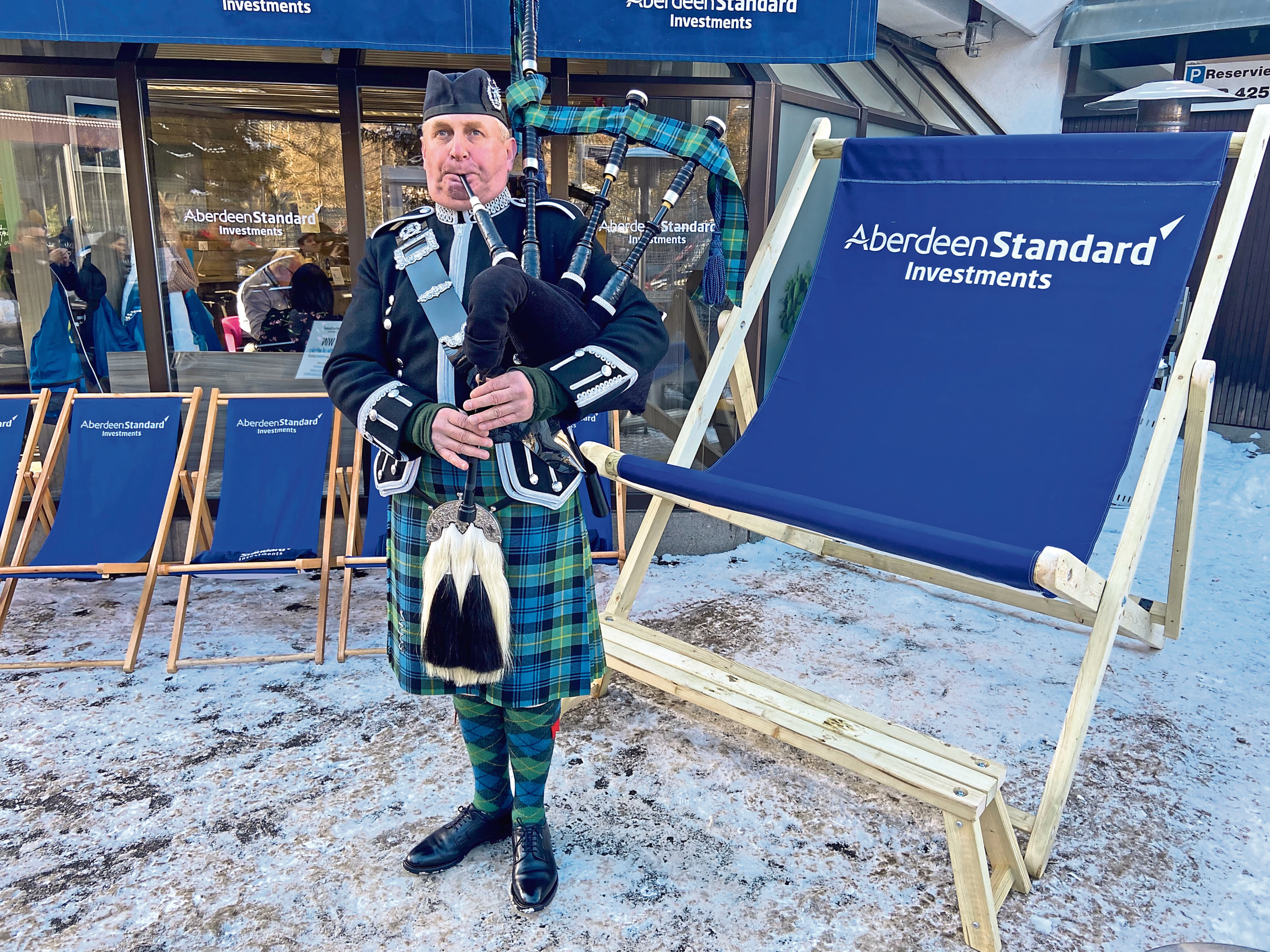 Stuart Samson playing the bagpipes outside the Aberdeen Standard Investments Cafe at the World Economic Forum in Davos.