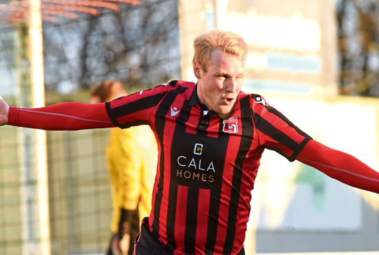 Chris Angus celebrating after scoring to make 2-0.

Picture by KENNY ELRICK