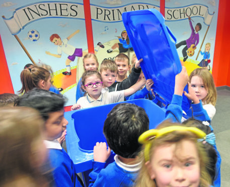 Pupils at Inshes Primary School, Inverness take a first look at their new blue recycling bin which has been installed in the school.
Picture by Sandy McCook