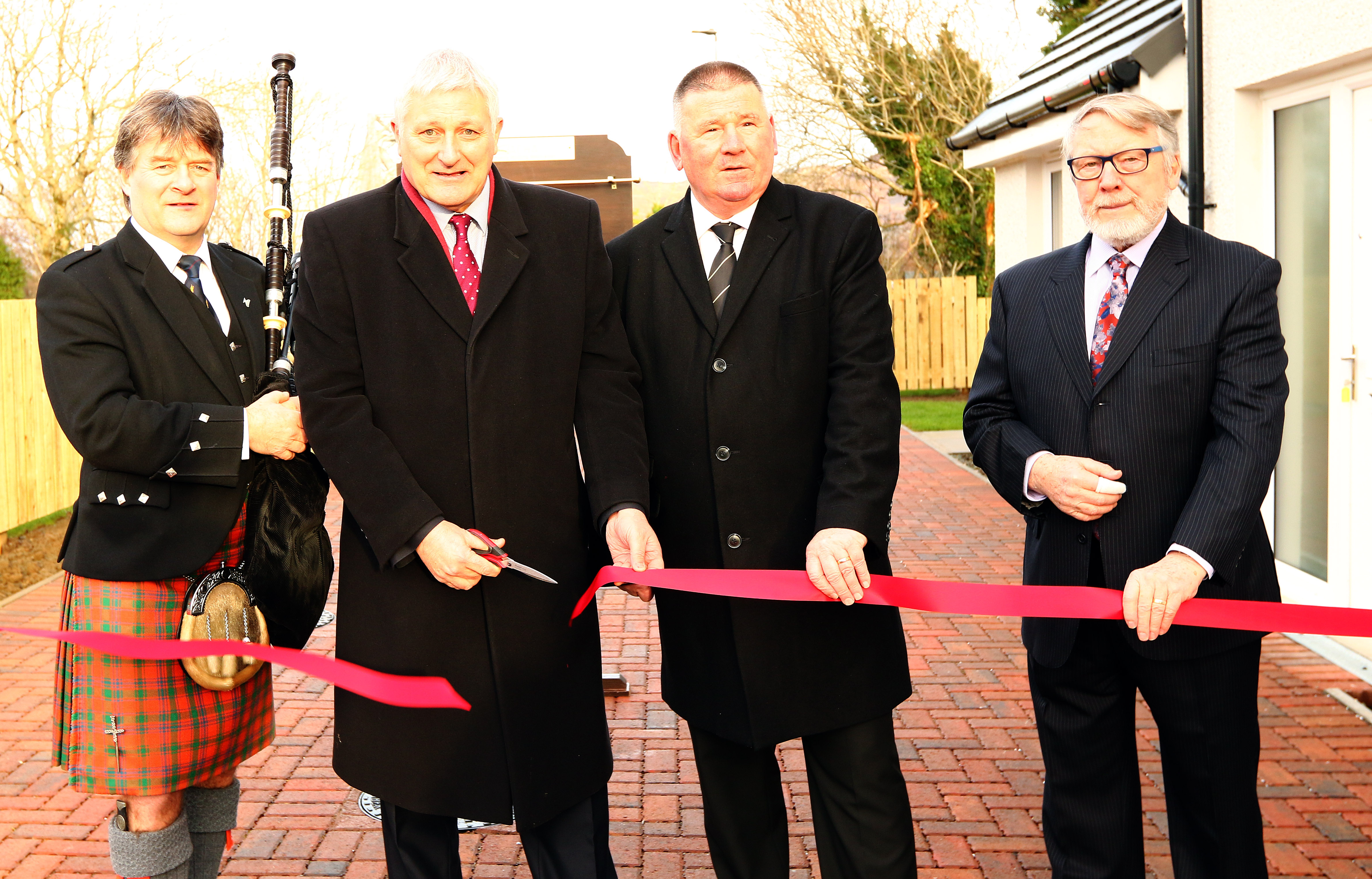 CR Pipe major A MacColl, John Finnie MSP, Councillor Roddy McCuish, Jim Milne at the Connel opening