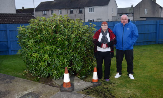 Hazel Moir and Robert Knowles complained about the uncovered manhole in her garden.