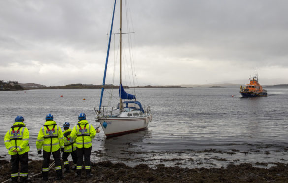 Oban lifeboat and coastguard members aid a stricken yacht in Connel Bay