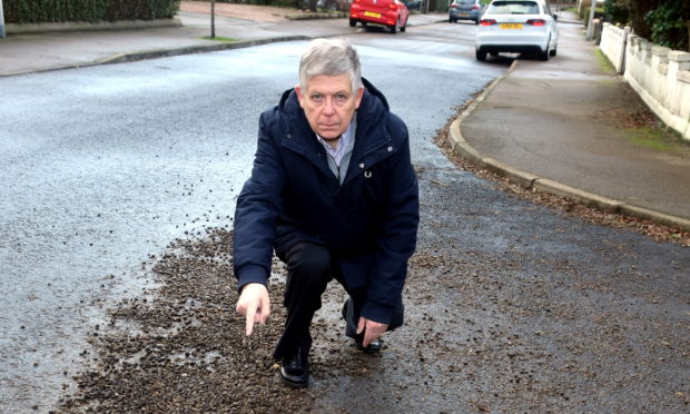 William Sell at the junction of Burnieboozle Crescent and Craigiebuckler Place, earlier this year before the stretch had been repaired