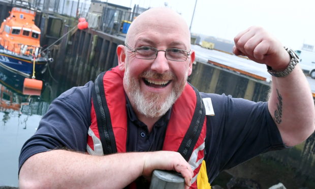 Vic Sutherland is raising money for the RNLI by lifting the total weight of each lifeboat class.
Picture by Chris Sumner.