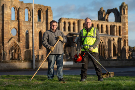 James Wiseman (left) and Douglas Read who are both members of the community grass cutting group. Picture by Jason Hedges.