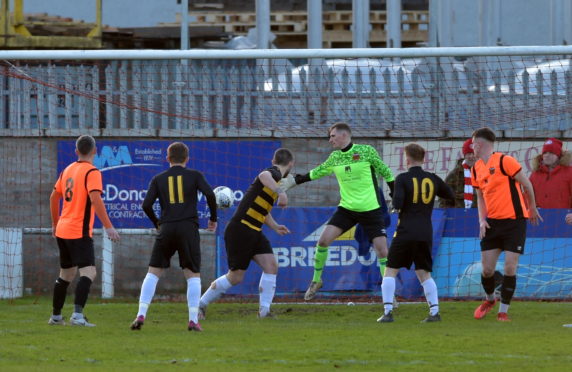 Jordan MacRae scores.
Pictures by Jason Hedges