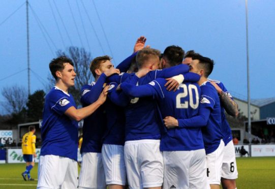 Jamie Masson celebrating with team mates after scoring to make it 3-0.

Picture by KENNY ELRICK