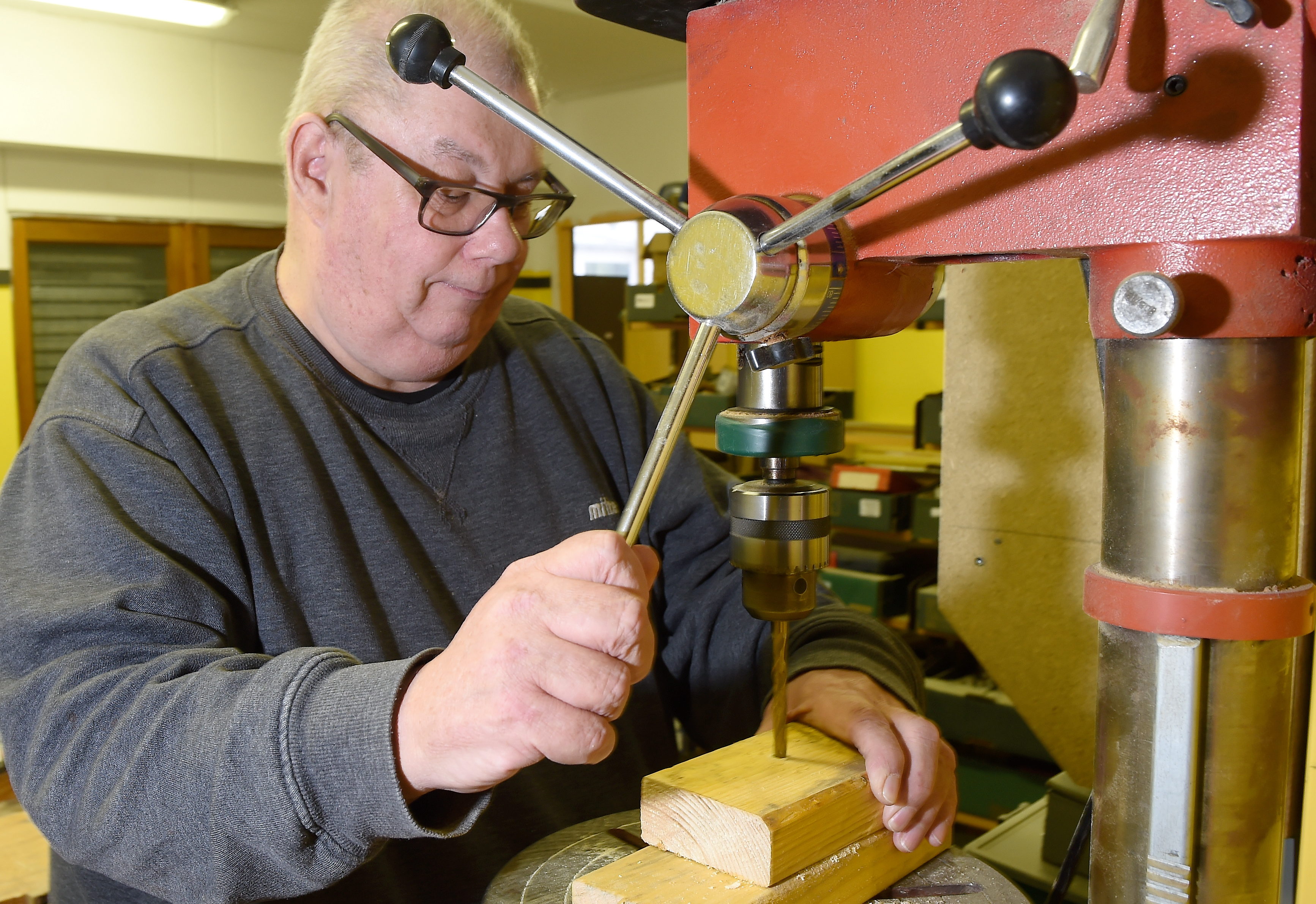 Member Bob Irwin at work on the drill press. Picture by Sandy McCook