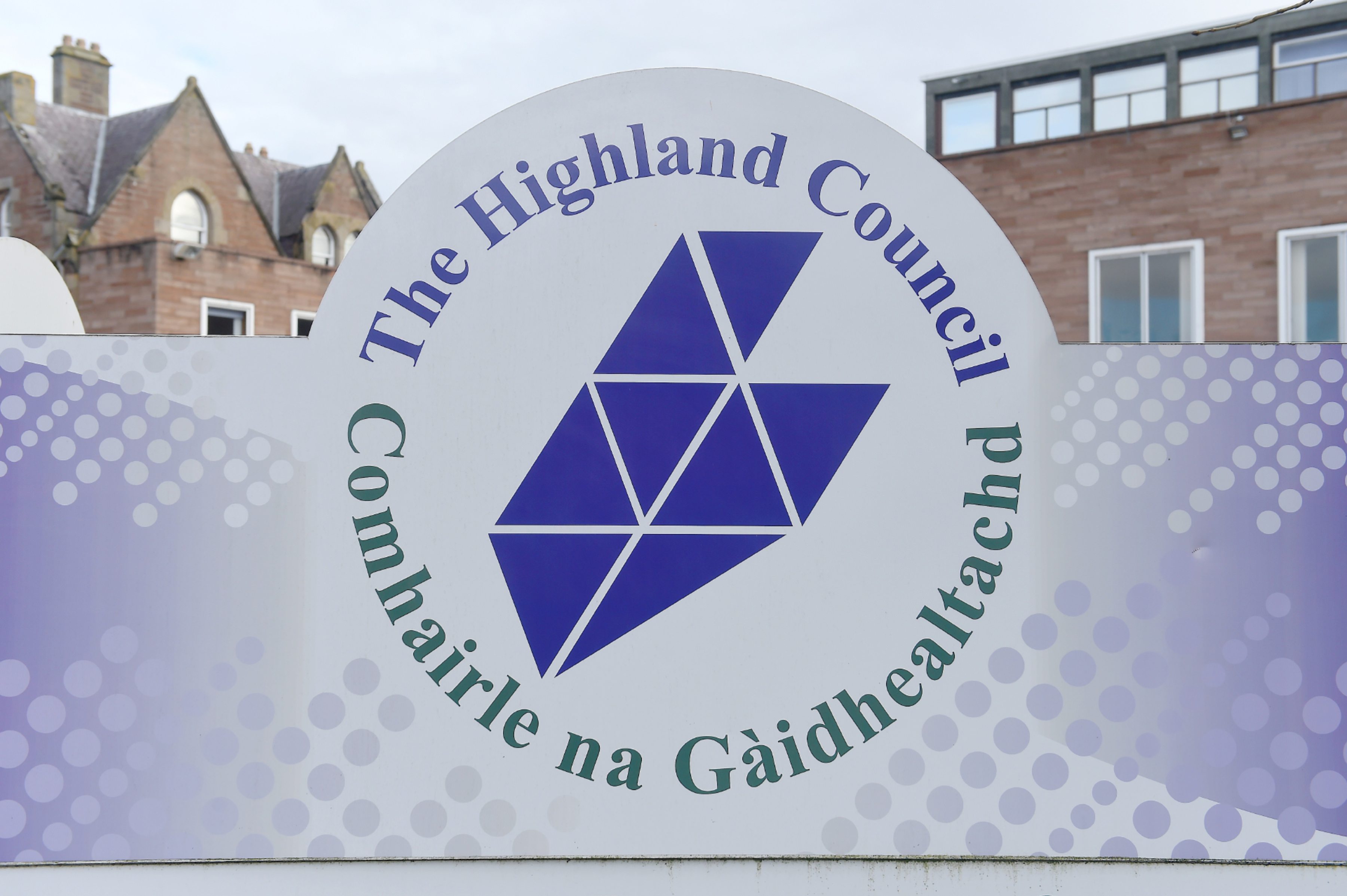The sign outside the front door of Highland Council headquarters in Inverness, It reads The Highland Council and then the name in Gaelic as well.