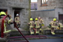 Fire crews at the scene of a house blaze in Rosehearty
