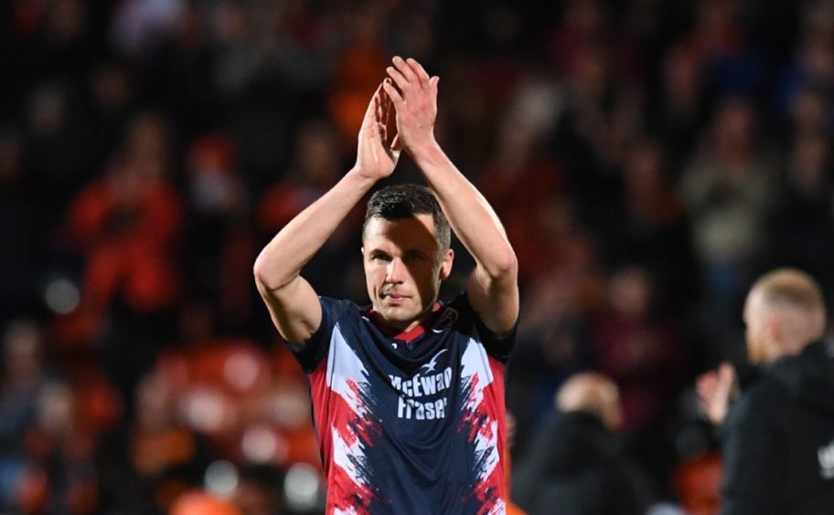 Ross County's Don Cowie clapping above his head