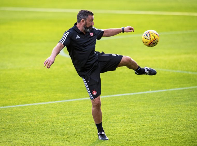 Derek McInnes hits a volley.