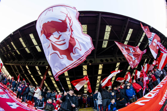 Aberdeen fans get behind their team at the Scottish Cup tie against Dumbarton in January.