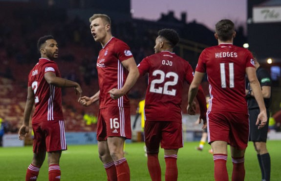 Sam Cosgrove, second left, with team-mates including Funso Ojo after scoring.