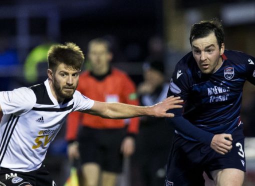 Ayr's Aaron Muirhead (L) and Ross County's Sean Kelly in action