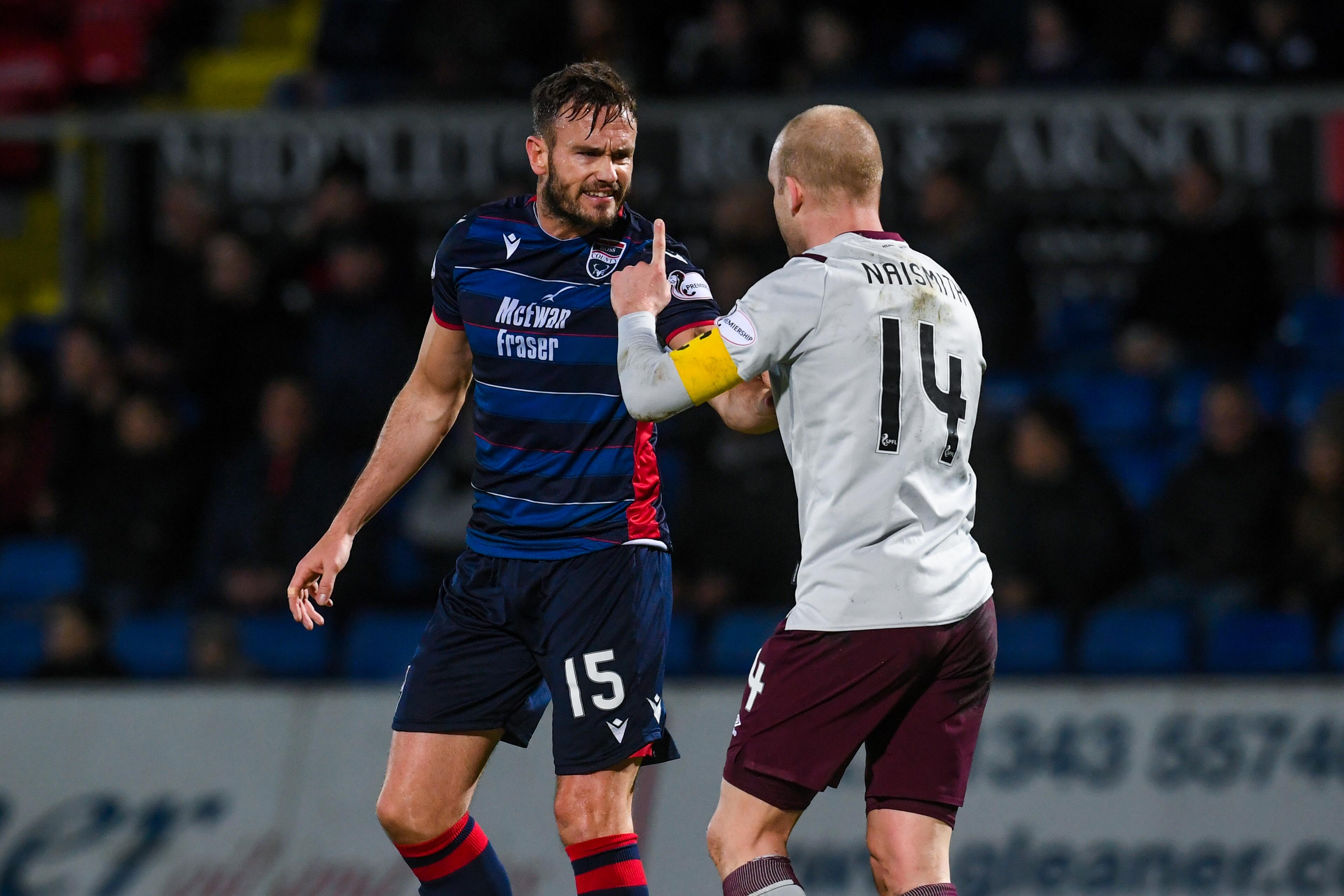 Keith Watson and Steven Naismith exchange verbals during the clash at Victoria Park between Ross County and Hearts