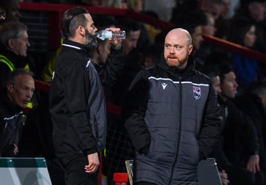 Ross County co-managers Stuart Kettlewell (L) and Steve Ferguson during the Ladbrokes Premiership match between Ross County and Hearts at the Global Energy Stadium.