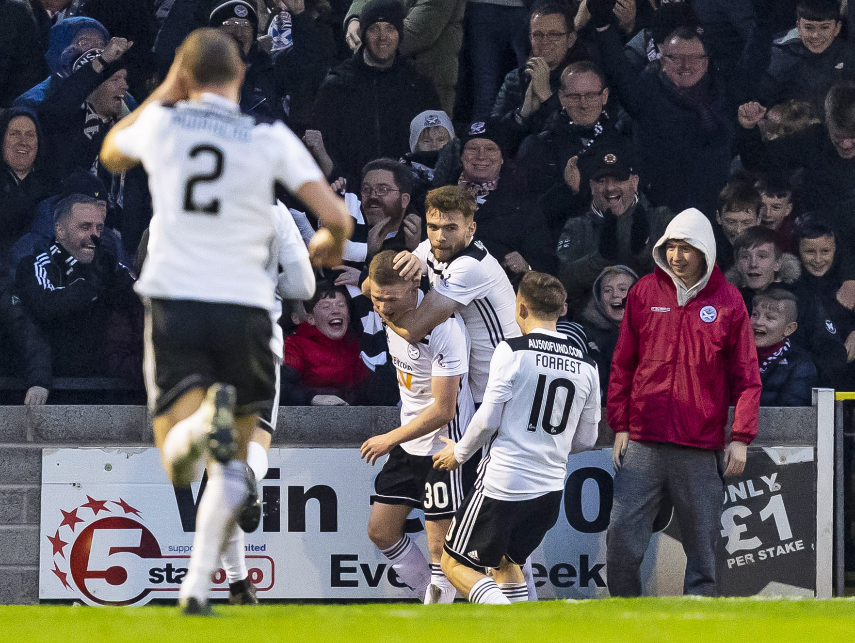 Stephen Kelly is mobbed after his goal.