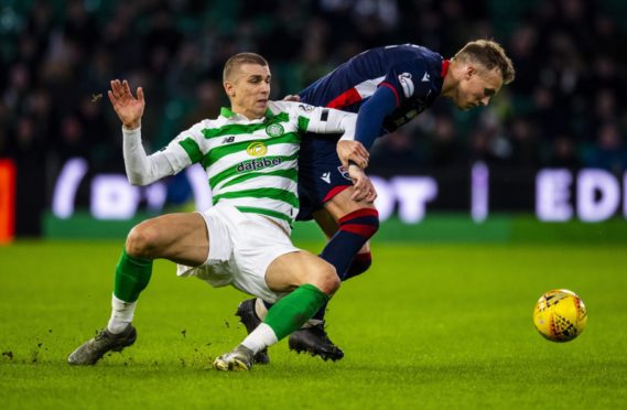 Celtic's Jozo Simunovic and Lee Erwin in action during the Ladbrokes Premiership match between Celtic and Ross County