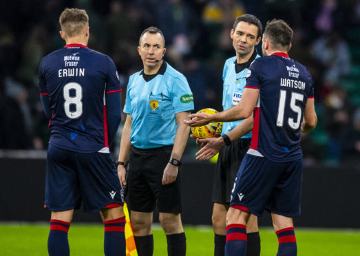 Keith Watson protests with referee Kevin Clancy over the awarding of a first-half penalty during the Ladbrokes Premiership match between Celtic and Ross County.