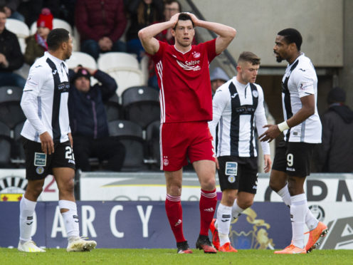 Scott McKenna reacts after seeing a first-half shot deflected over.