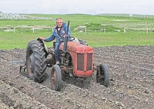 Allan MacCallum, 46, had been inspecting a new baling machine which was an attachment for his tractor when tragedy struck.