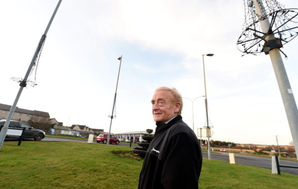 George Penny next to the broken Christmas lights 
Picture by Jim Irvine  9-1-20