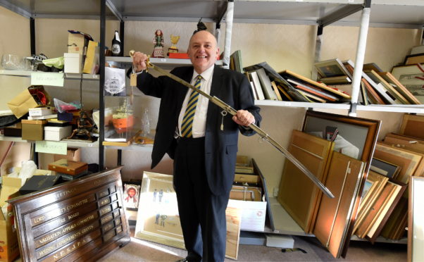 Lord Provost Barney Crockett with the sword.
Pic by Jim Irvine.