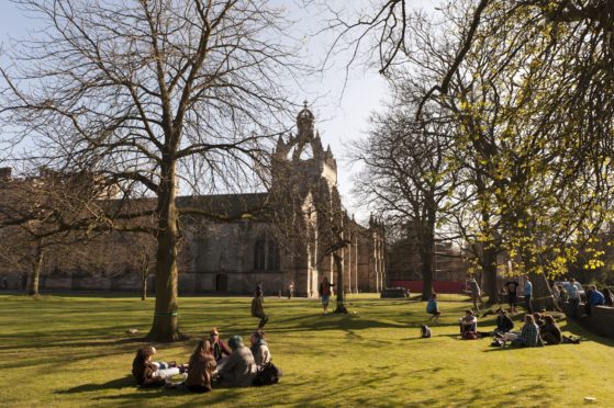 Students enjoying the sunshine at Kings College in Aberdeen.