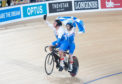 Neil Fachie and Matt Rotherham celebrate one of their wins at the 2018 commonwealth Games.