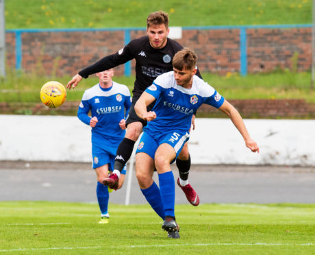 Luc Bollan in action for Cowdenbeath with Clyde's David Goodwillie.