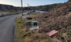 Plastic boxes and office chairs have been dumped at Cove Harbour.