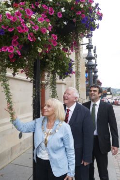 Previous Town House flowers being admired by provost Helen Carmichael