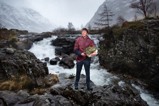 John Currie, Visitor Services Supervisor at Glencoe, with his Hug of Heather