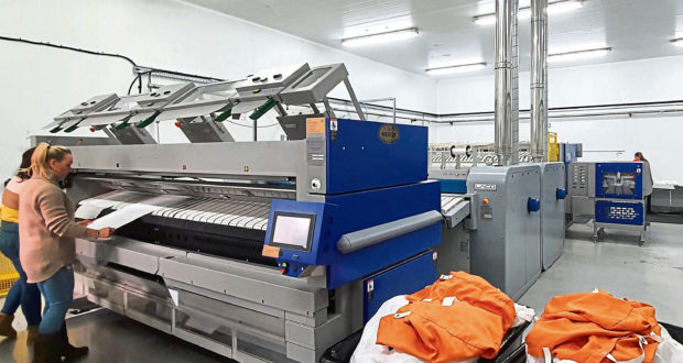 Commercial laundry firm MacKleeners has installed a new industrial iron to increase capacity, productivity and service quality.