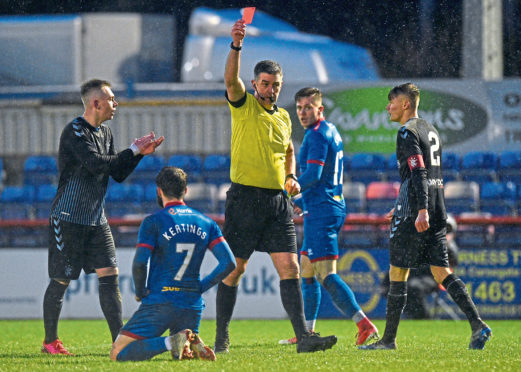 Inverness' James Keatings is shown red by referee Greg Aitken for simulation during the Tunnock's Caramel Wafer Cup semi-final between Inverness Caledonian Thistle and Rangers Colts.