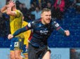 Ross County's Billy McKay celebrates after scoring to make it 1-1 during the Ladbrokes Premiership match between Ross County and St. Johnstone.