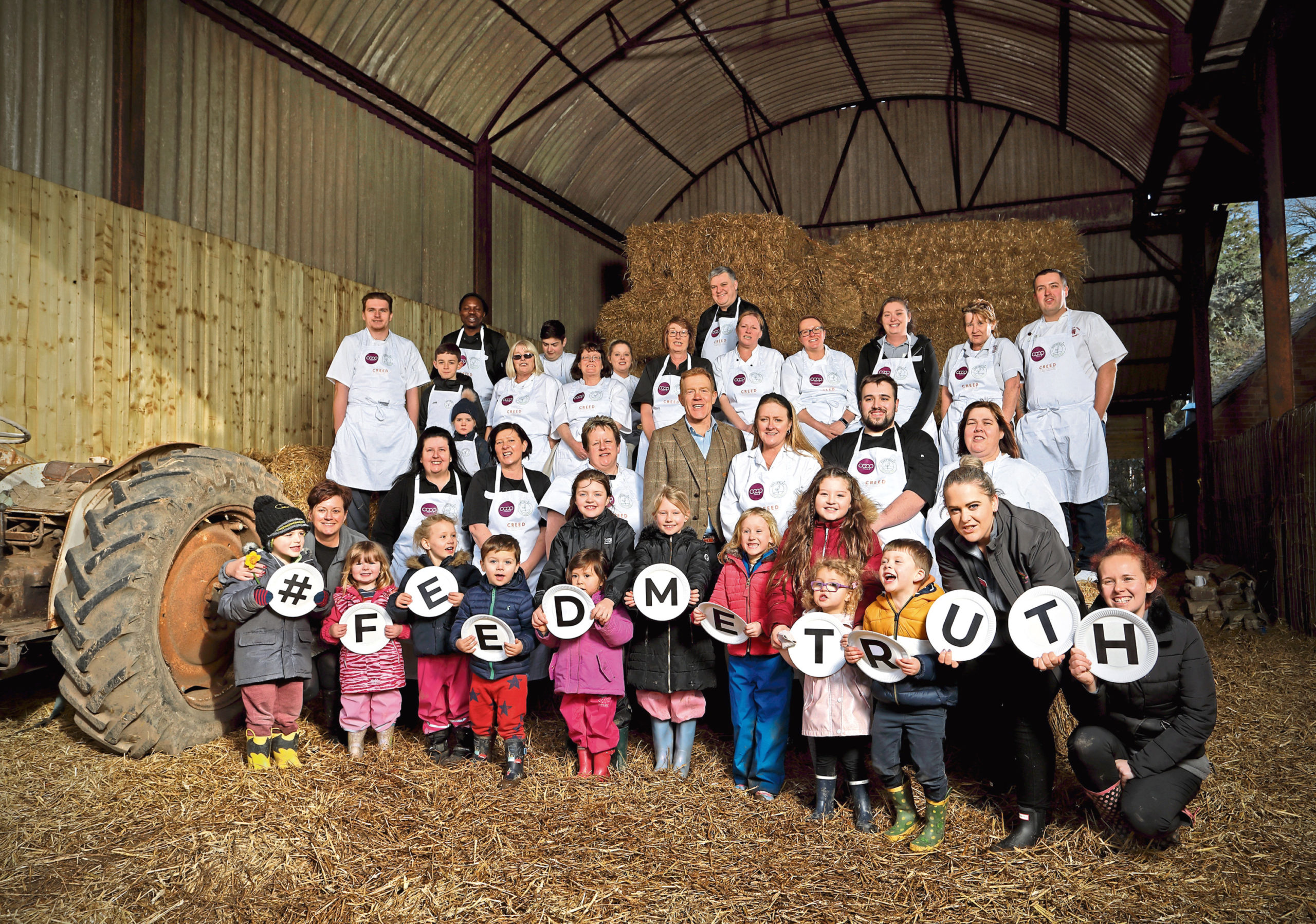 Co-operative Childcare chefs on Happerley's Gloucestershire farm with Adam Henson and local nursery children.