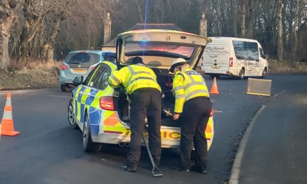 Police at the scene of the crash at Longside, Aberdeenshire.
Picture by Tamsin Ross.