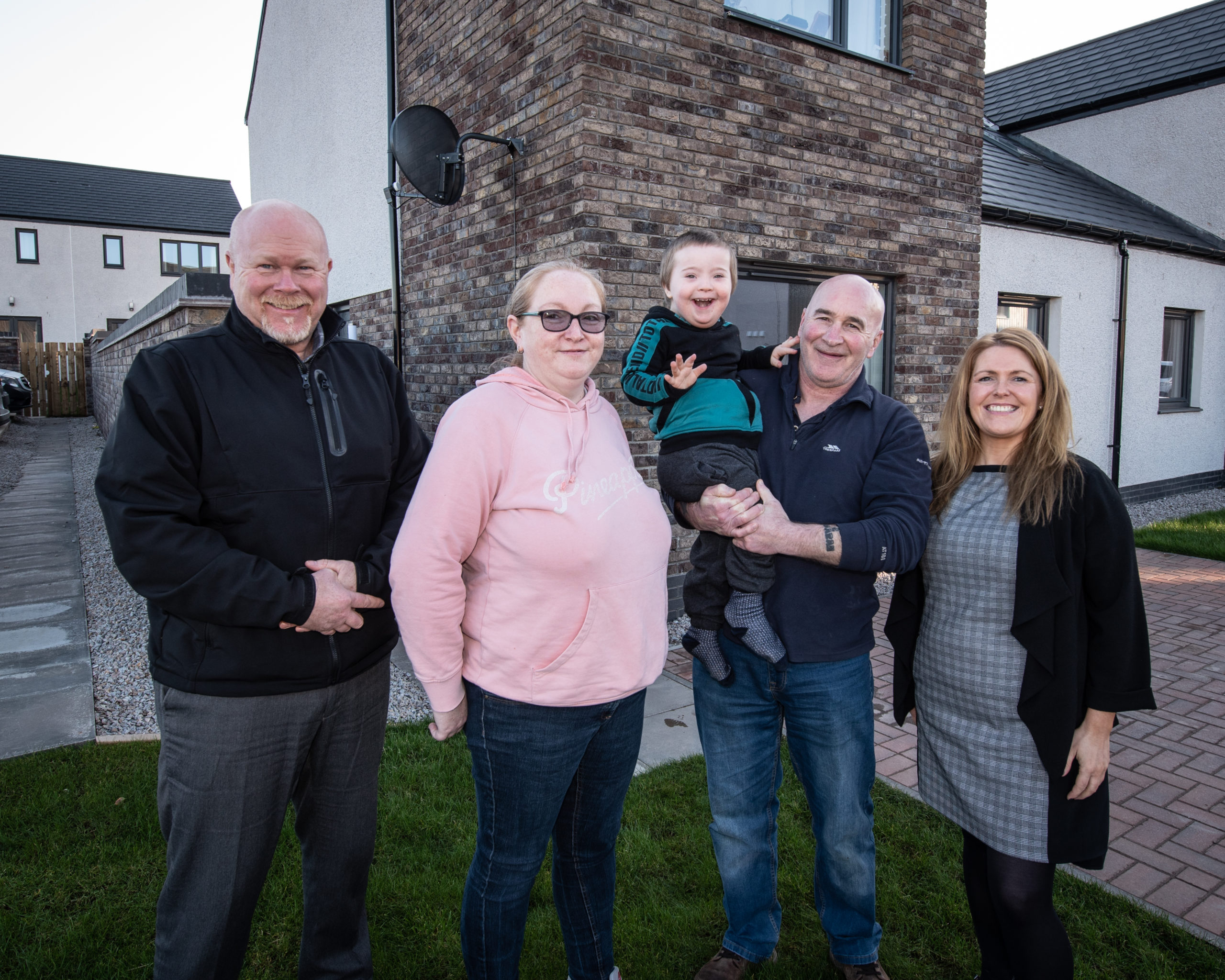 L-R: Allan Liddle, Development Officer Osprey Housing Group, Patricia Logie, Reece Logie, Kevin Logie and Stacy Angus, Osprey’s Housing Services Manager