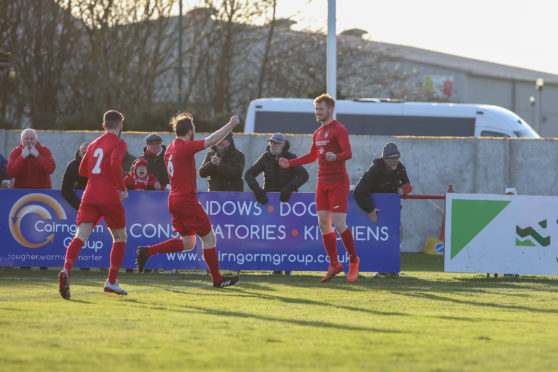 Brora's Greg Morrison celebrates as he opens the scoring.