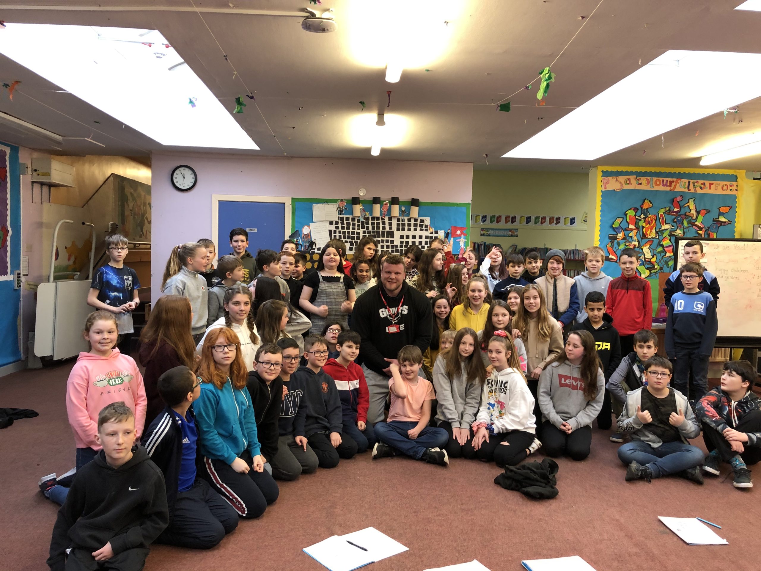 Tom Stoltman with primary seven pupils and staff following talk at Dingwall Primary School.