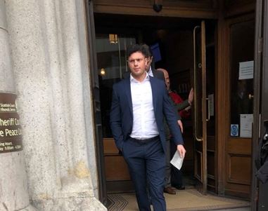 Evan Robertson leaving Aberdeen Sheriff Court