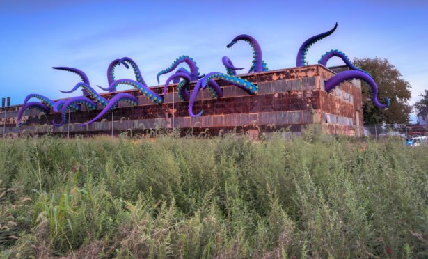 Giant tentacles sticking out of the Navy Yard in Philadelphia, created by Designs in Air