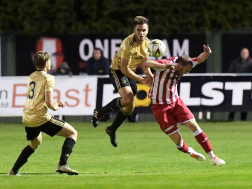 Luc Bollan jumps with with Formartine's Garry Wood.  
Picture by Kath Flannery